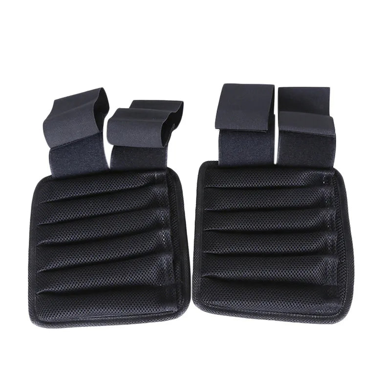 Two black car seat covers with straps on a white background