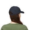 Person wearing a navy blue cap on a white background