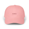 Pink cap with 'OLYMPUS' logo on a white background