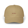 Beige cap with 'OLYMPUS' logo on a white background