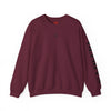 Maroon sweatshirt with black text on sleeve against a white background